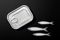 Example of open tin can with drawings of fish inside