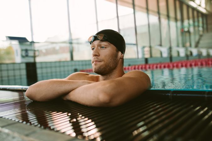 Pro male swimmer resting after a swim