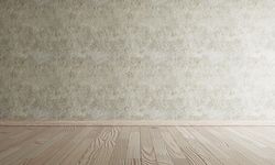 Minimal clean room with wooden floor and grey wall