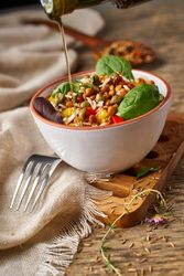 Bright vegetables with lentils and spinach in bowl