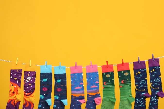 Casual clothes and wearing concept - socks, clothes for foot