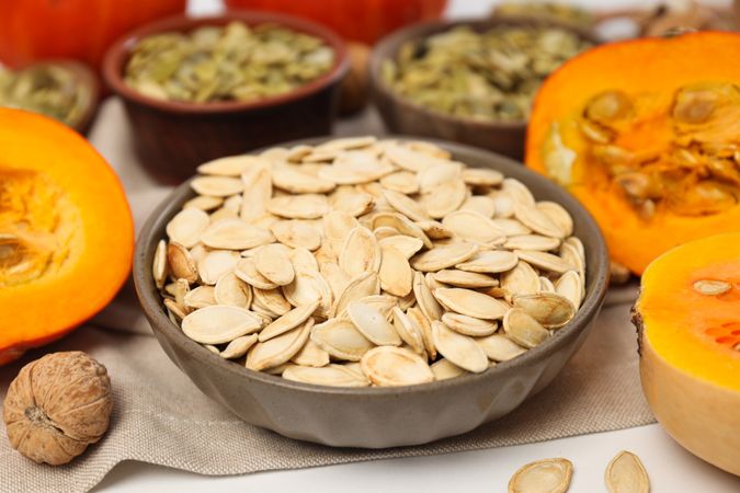 Cooking ingredients for fall season - pumpkin seeds, pumpkin