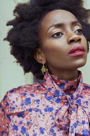 Portrait of Black woman in pink and blue floral top
