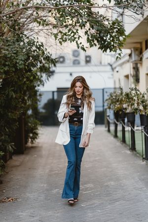 Woman talking phone on street