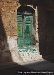 Green door and steps in the sunshine in Malta 4j9ov5