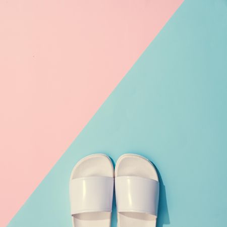 Painted flip flops with pastel pink and blue background