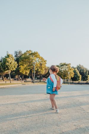Little girl standing in park