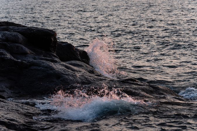 Waves crashing on rocky shore