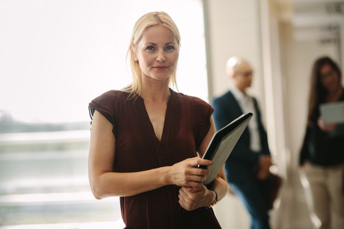 Confident business woman standing in office
