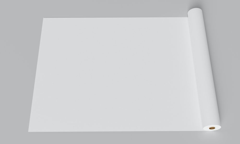 Paper roll opened on grey table
