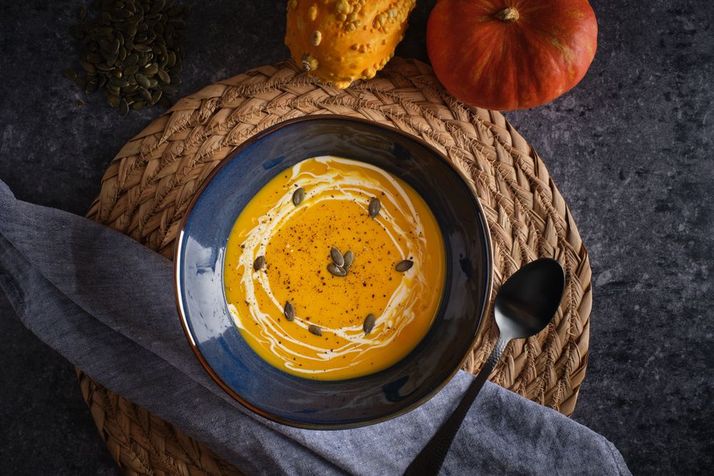 Tasty pumpkin cream soup in bowl