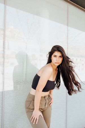 female standing near wall