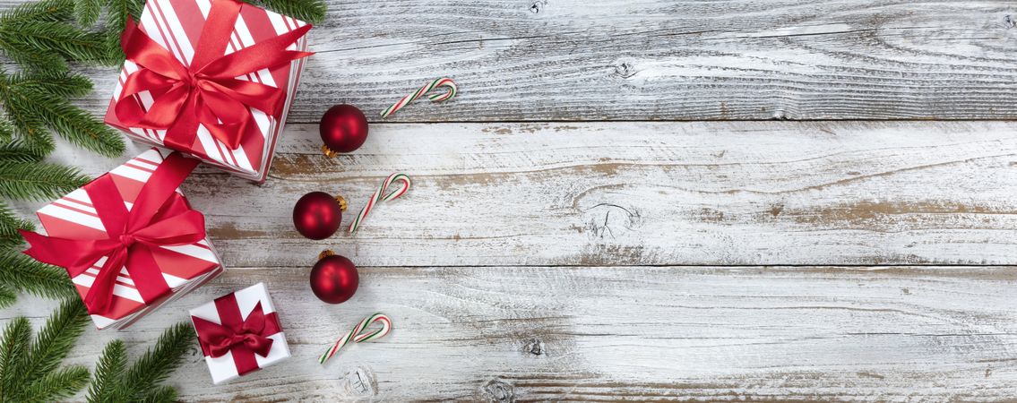 Merry Christmas holiday border on weathered wooden background