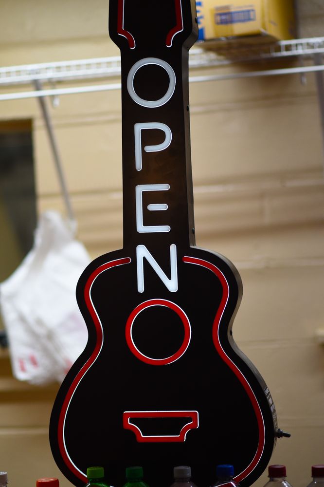 A guitar shaped OPEN sign