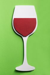 Silhouette of a glass of red wine made with cardboard