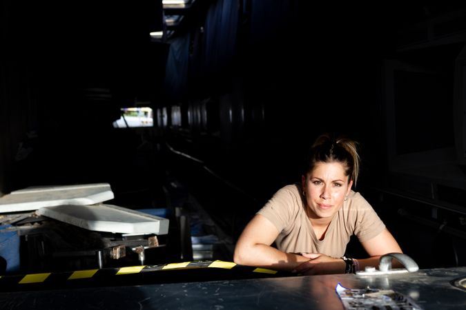 Military woman inside hangar
