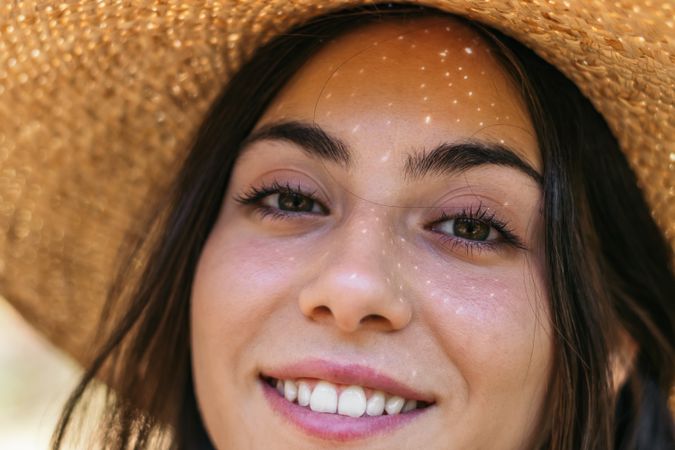 Portrait of a woman with a straw hat