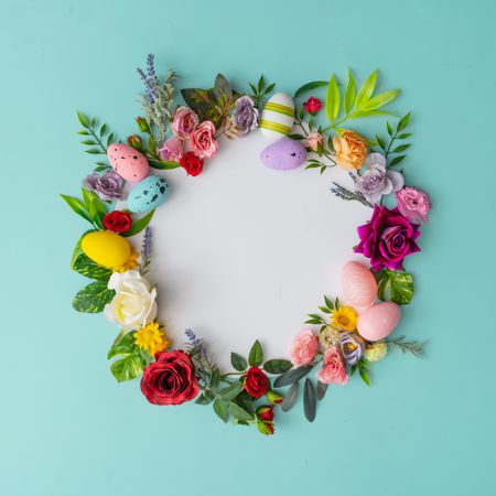 Spring wreath made of colorful flowers and leaves
