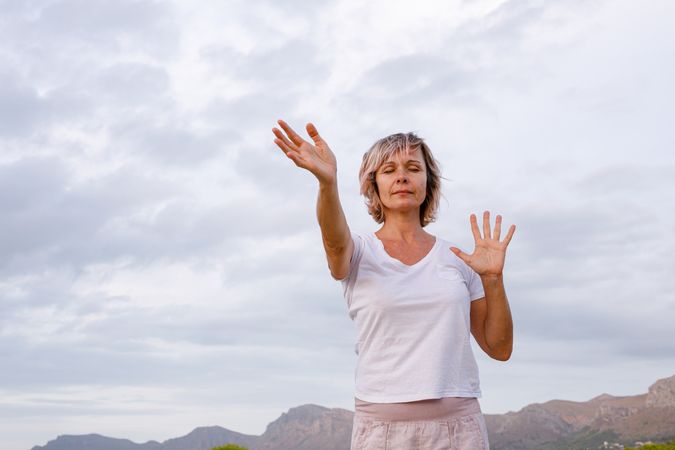 Adult woman doing breathing exercise
