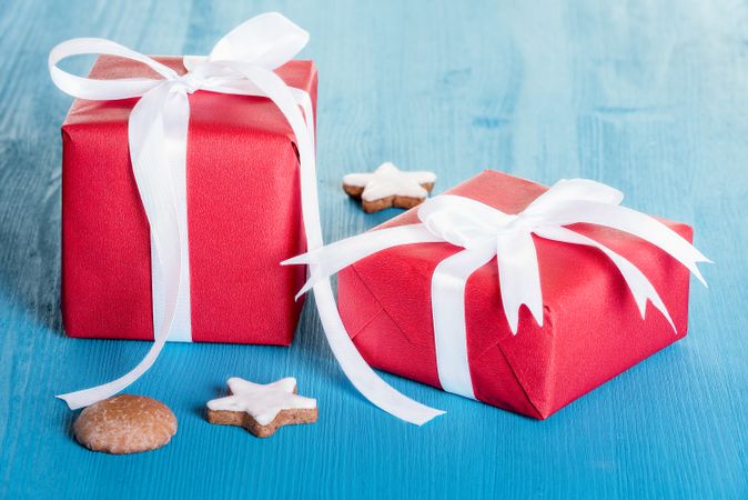 Gift boxes wrapped in red paper with ribbons