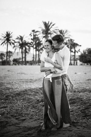 Happy kissing couple on beach