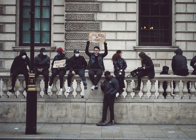 London, England, United Kingdom - June 6th, 2020: BLM protesters sitting along wall