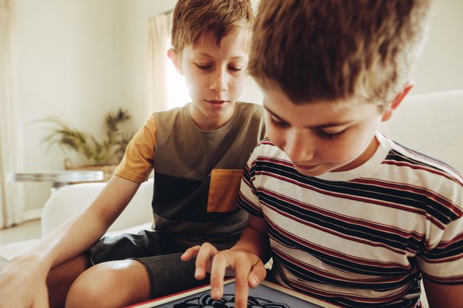 Boys spending time learning on a tablet pc
