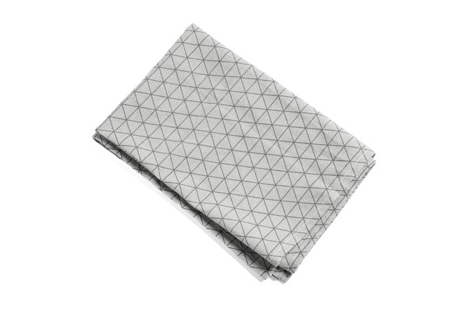 Folded grey napkin isolated on plain background, top view