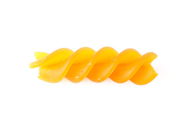 Pasta isolated on bright background, closeup. Dry raw whole pasta
