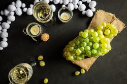Glasses with wine and grapes