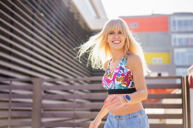 Careful blonde woman in city