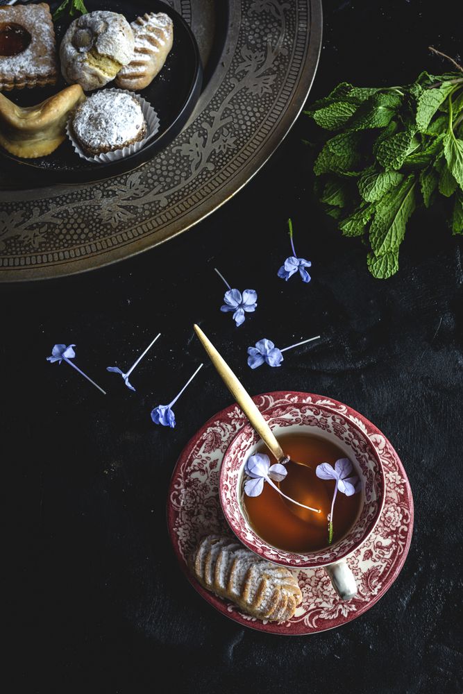 Traditional tea with mint and assorted Arab sweets