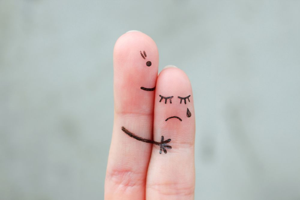 Fingers art of mother comforts her daughter.