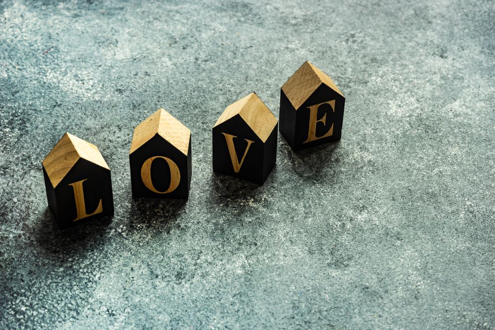 Valentine's day card concept with the word "love" on grey counter