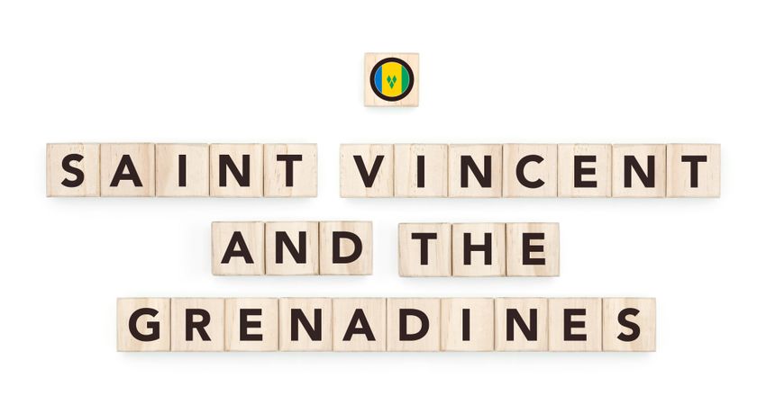 Wooden blocks bearing the name and flag of Saint Vincent and the Grenadines. Grenadinian and Caribbean Culture, national identity, travel, and geography in a copy space design.