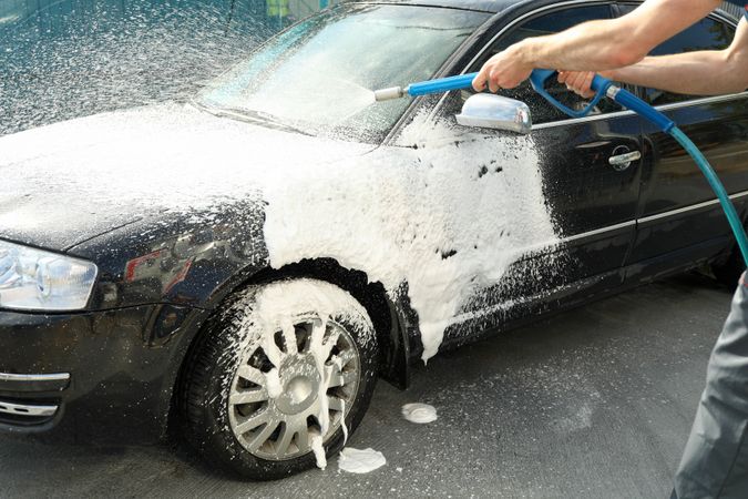 A man washes a car. Clear car concept