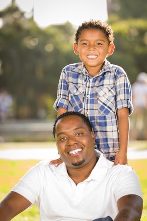 Happy Father and Son Standing In the Sun