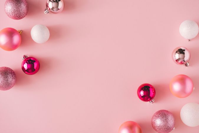 Pink holiday decorations on pink background