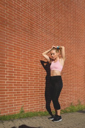 A woman is preparing to go jogging