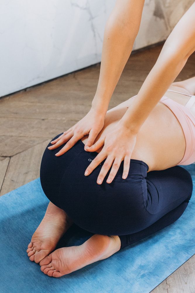 Cropped image of yogi stretching back on Pilate
