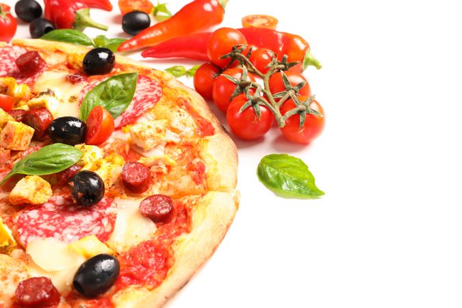 Delicious pizza and ingredients isolated on blank background, close up