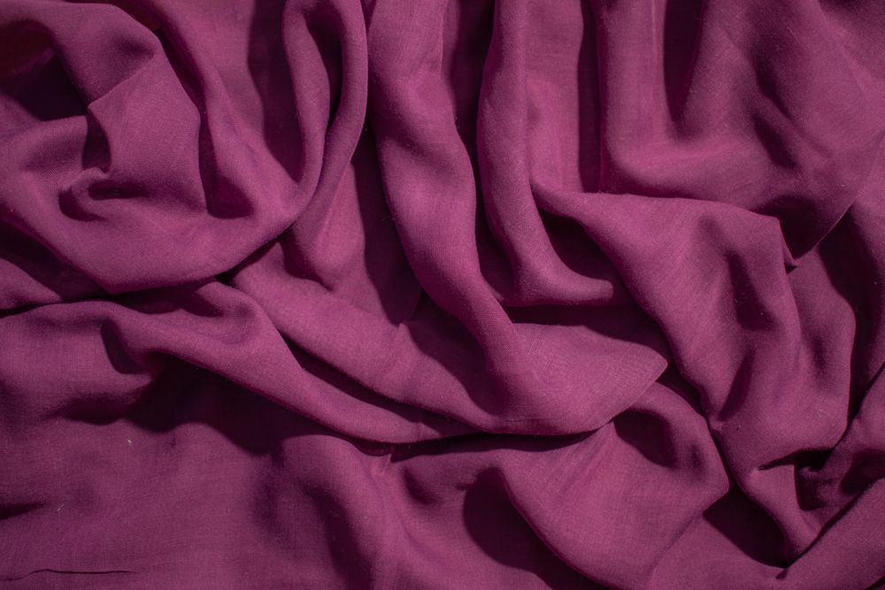 Soft purple fabric wavy crumpled background abstract.