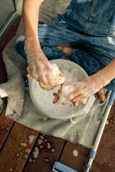 Unrecognizable child washing wipers in bucket