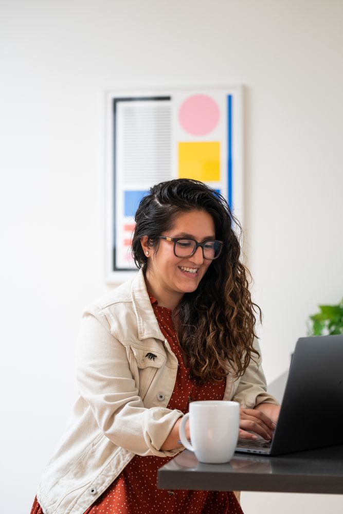 Woman smiling at her laptop