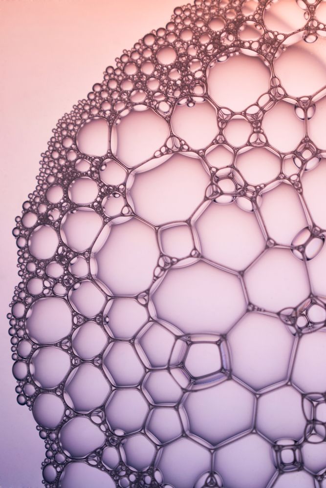 Abstract background bio technology, macro photography foam and water with gradient background. Molecule multicolor backgorund