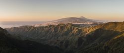Sunrise in foggy wild mountains