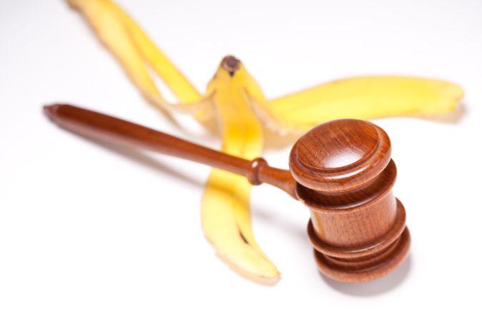 Gavel and Banana Peel on Gradated Background