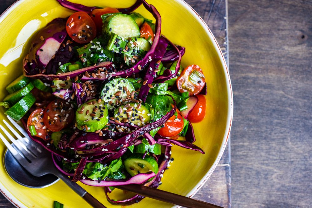 Top view of vegetable salad and with cabbage and sesame seeds