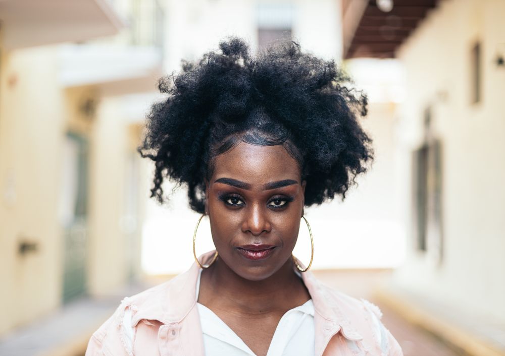 Portrait of a pretty Black woman with afro hair