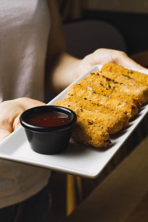 Chicken fillet in batter and red sauce